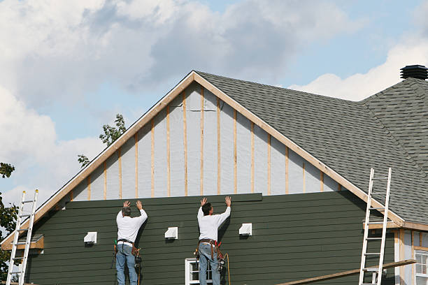 Professional Siding Contractor technician working in Carlisle, MA